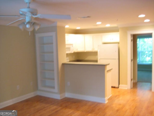 kitchen with recessed lighting, white appliances, light wood-style flooring, and baseboards