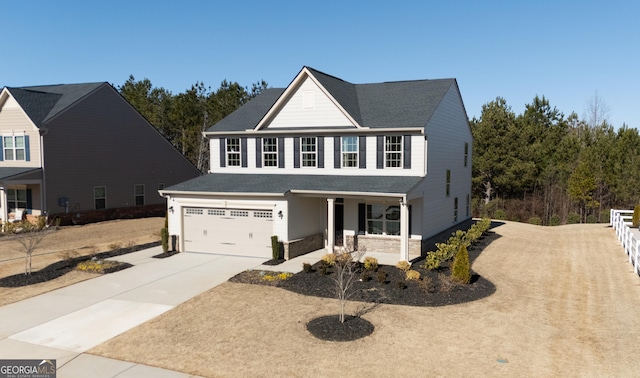 view of front facade featuring a garage, driveway, and a porch