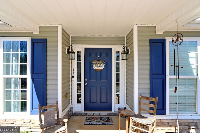 entrance to property featuring a porch