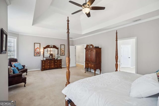 bedroom with visible vents, light carpet, a raised ceiling, crown molding, and baseboards