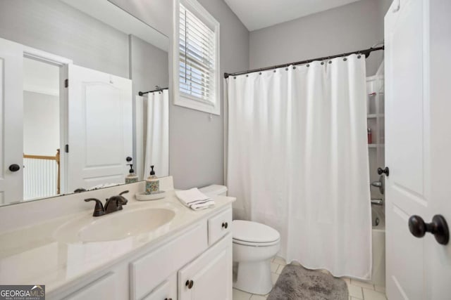 full bath with shower / tub combo, toilet, vanity, and tile patterned flooring