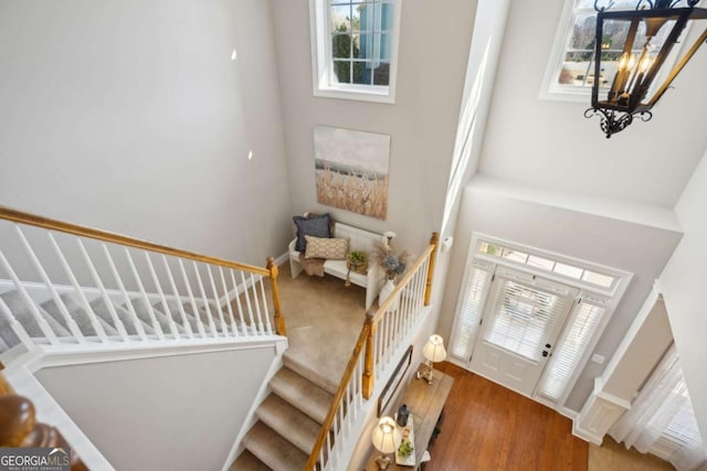 entrance foyer featuring stairs and wood finished floors