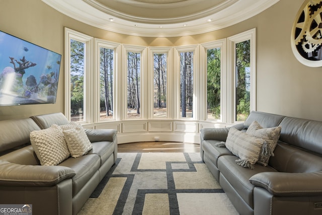 living area with recessed lighting and ornamental molding