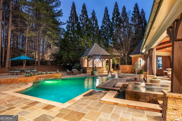 pool featuring a storage structure, an outdoor structure, and a patio area