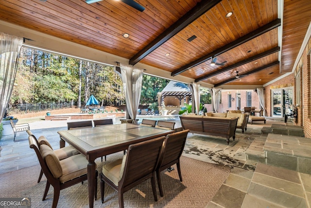 view of patio featuring outdoor lounge area, outdoor dining space, fence, and a pergola