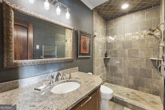 bathroom with toilet, a stall shower, radiator, tile patterned flooring, and vanity