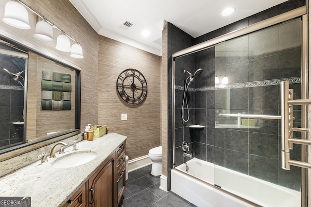 full bath with tile patterned floors, visible vents, toilet, bath / shower combo with glass door, and vanity