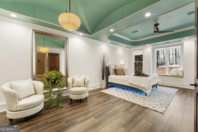 bedroom featuring lofted ceiling, recessed lighting, wood finished floors, and baseboards