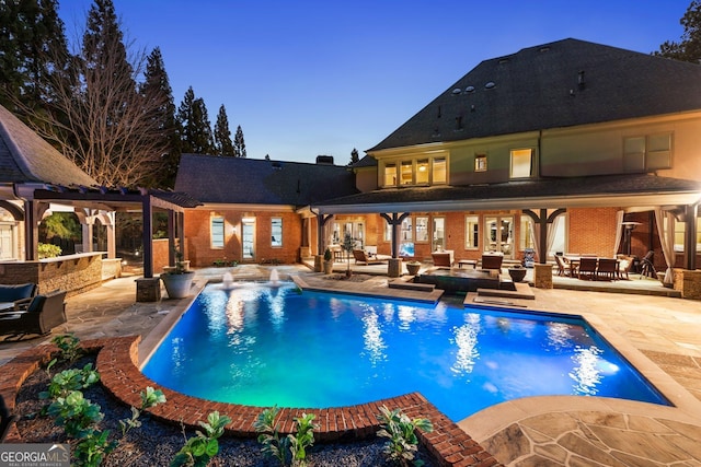 outdoor pool featuring a patio area and a pergola