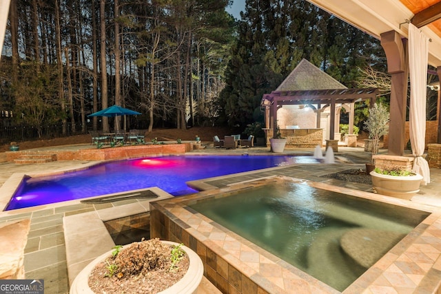 pool with a patio, an in ground hot tub, and a pergola