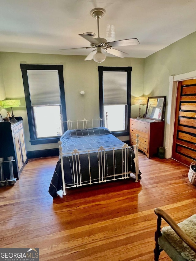 bedroom featuring ceiling fan and wood finished floors