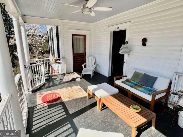 view of patio with an outdoor living space and a ceiling fan