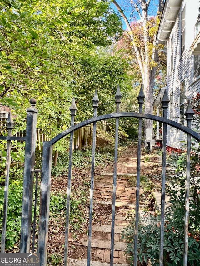 view of gate with fence