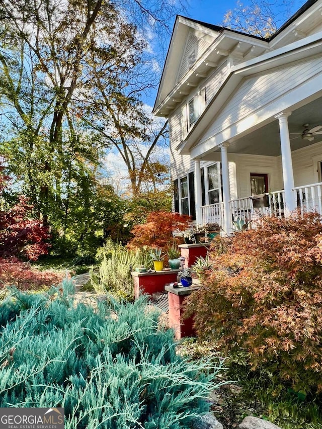 view of side of property featuring a porch