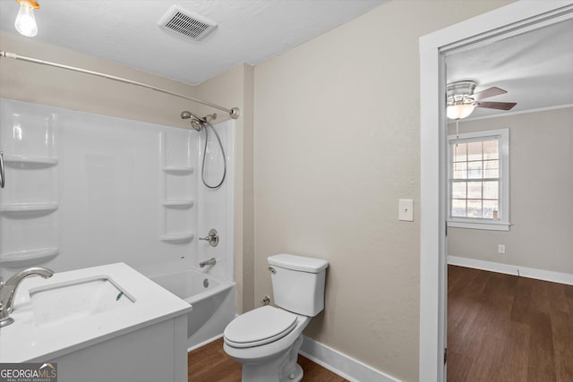 full bath featuring baseboards, visible vents, toilet, ceiling fan, and wood finished floors