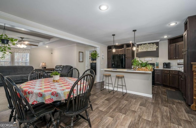 dining space with recessed lighting, dark wood-style flooring, crown molding, and ceiling fan