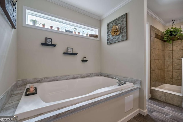 full bathroom featuring ornamental molding, a garden tub, and tiled shower