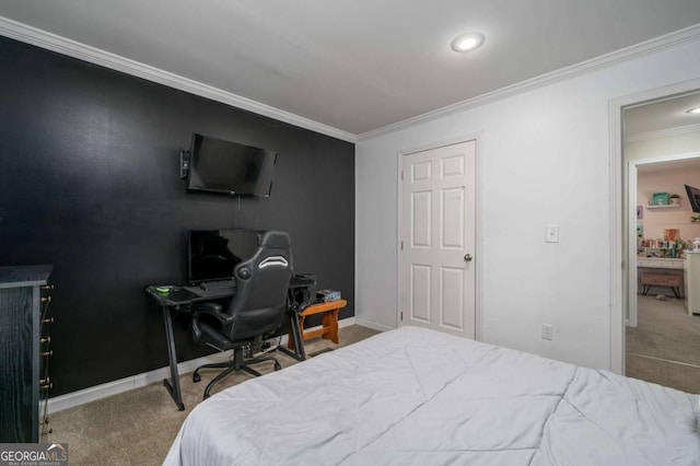 carpeted bedroom featuring baseboards and crown molding