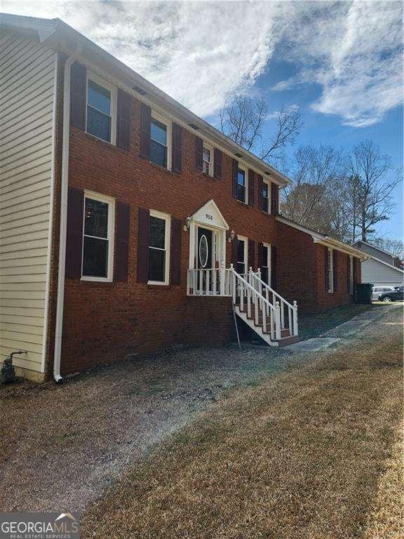 colonial home with brick siding