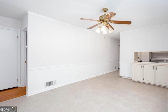 unfurnished living room featuring ceiling fan, baseboards, and visible vents