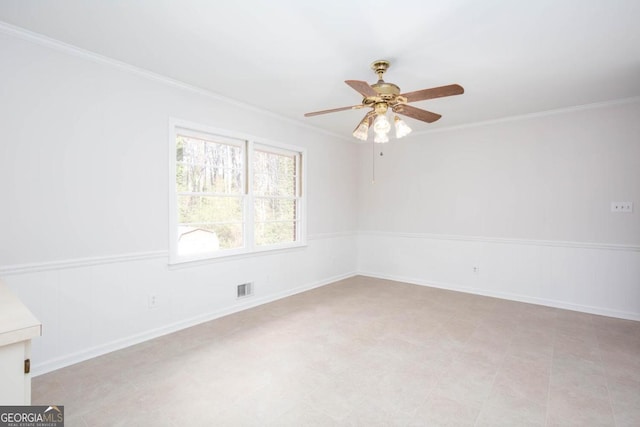 unfurnished room with crown molding, visible vents, and ceiling fan