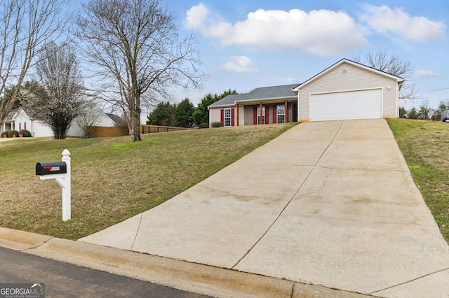 single story home featuring an attached garage, driveway, and a front lawn