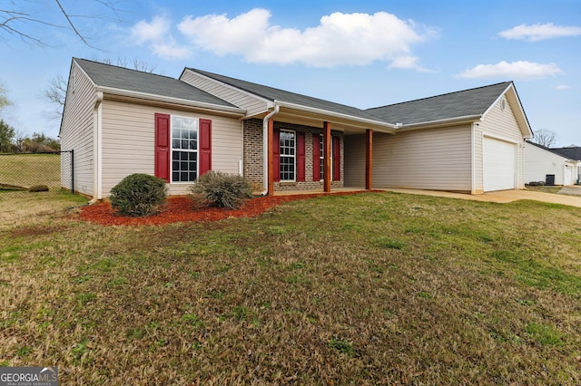 ranch-style house with a front yard, concrete driveway, fence, and an attached garage