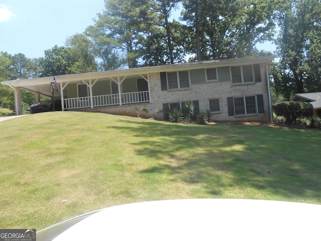 view of front of property with brick siding and a front yard