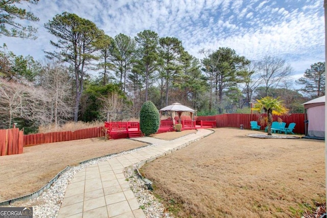 view of yard featuring a gazebo and fence