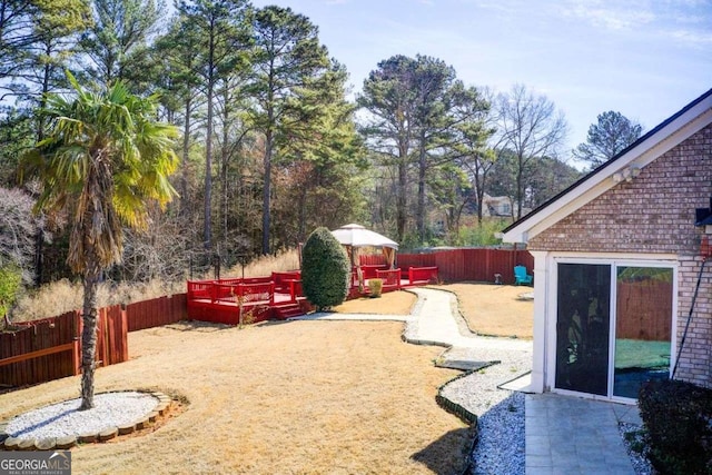 view of yard featuring a patio and a fenced backyard