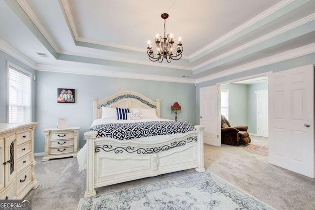 bedroom with a tray ceiling, light carpet, a notable chandelier, and crown molding