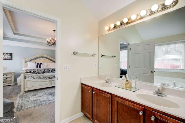 bathroom featuring a sink, connected bathroom, a notable chandelier, and double vanity