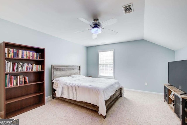 bedroom with light carpet, visible vents, baseboards, and vaulted ceiling