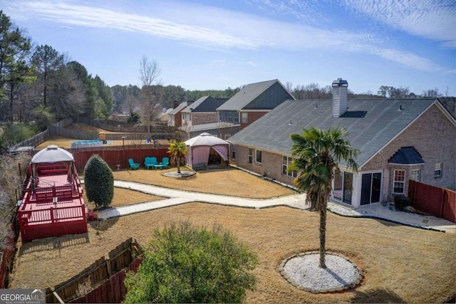 view of yard with a gazebo and a fenced backyard