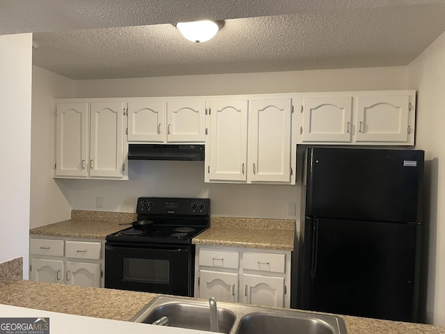 kitchen with black appliances, under cabinet range hood, white cabinets, and a sink