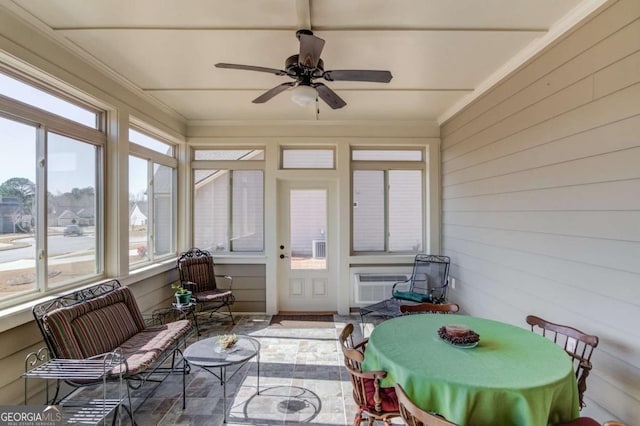 sunroom with a ceiling fan