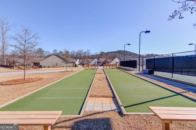 view of property's community with fence