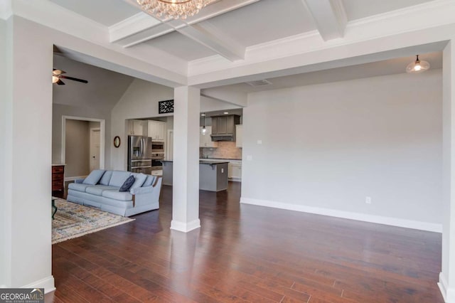 living area featuring baseboards, dark wood finished floors, and beam ceiling