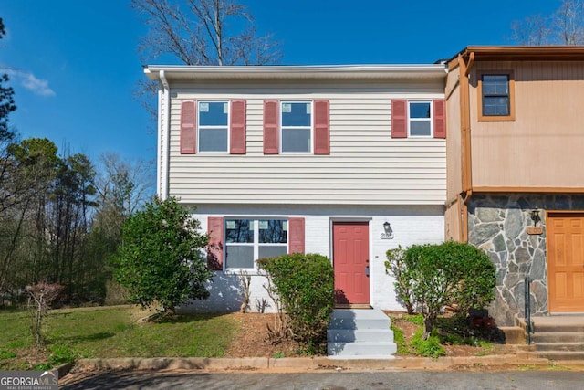 view of front facade featuring brick siding