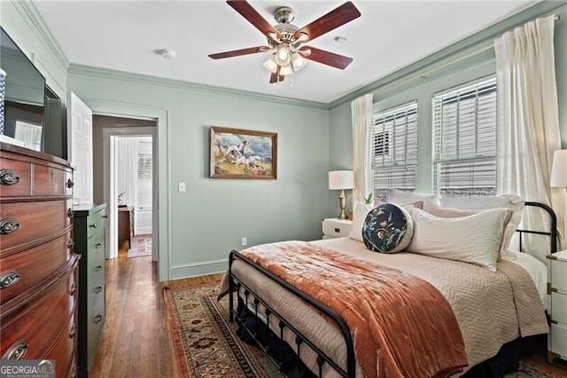 bedroom featuring ornamental molding, wood finished floors, a ceiling fan, and baseboards