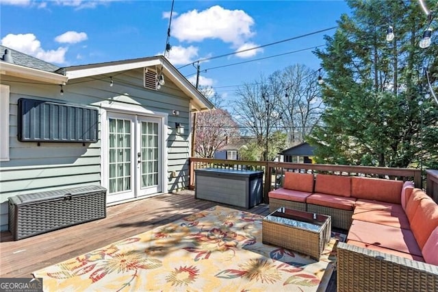 deck featuring an outdoor hangout area and french doors