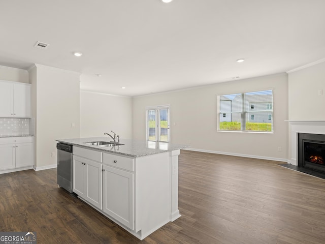 kitchen featuring a fireplace with flush hearth, a sink, stainless steel dishwasher, open floor plan, and dark wood finished floors