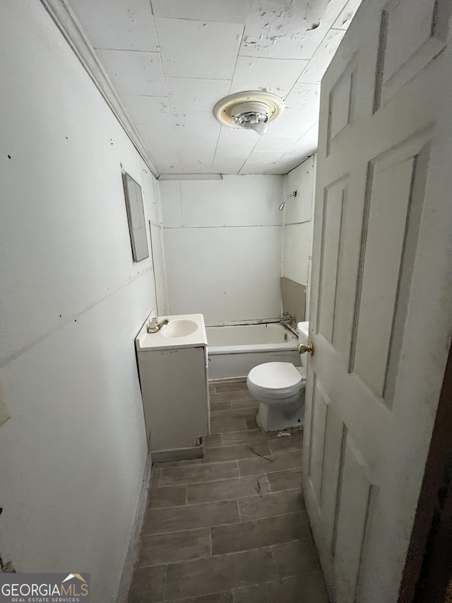 bathroom featuring shower / washtub combination, vanity, toilet, and wood tiled floor