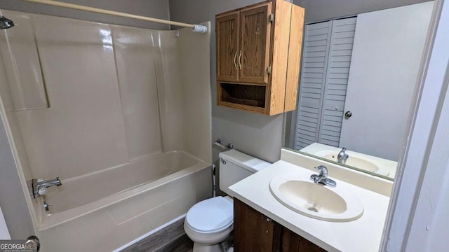 bathroom with shower / bath combination, vanity, and toilet