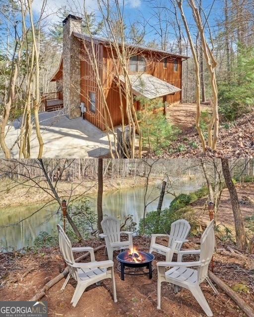 exterior space with a water view and an outdoor fire pit