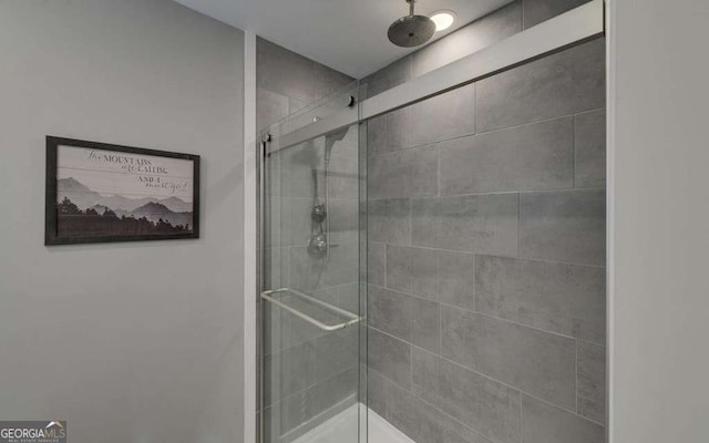 bathroom with a shower stall