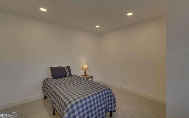 bedroom with recessed lighting, baseboards, and carpet