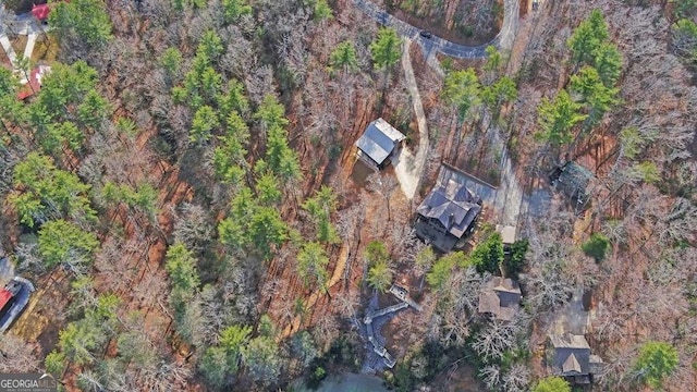 aerial view featuring a wooded view