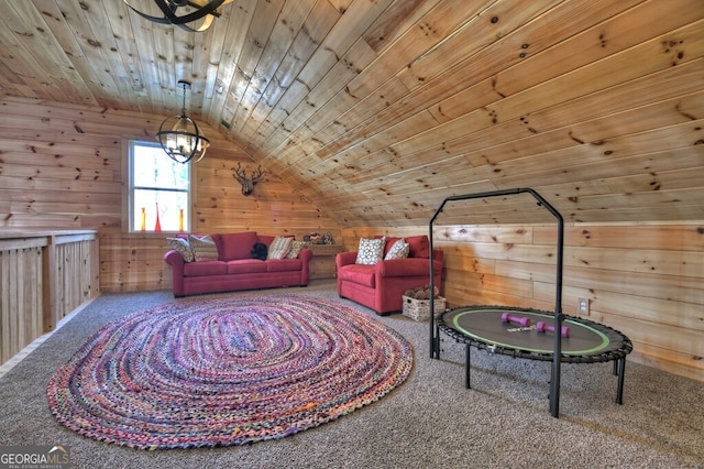 interior space with lofted ceiling, wooden ceiling, wooden walls, and carpet