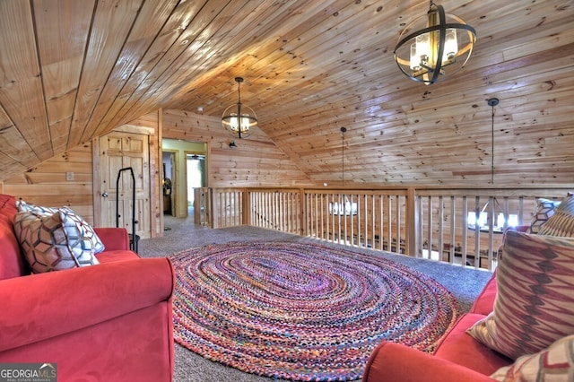 sitting room with wooden ceiling, wood walls, and carpet floors